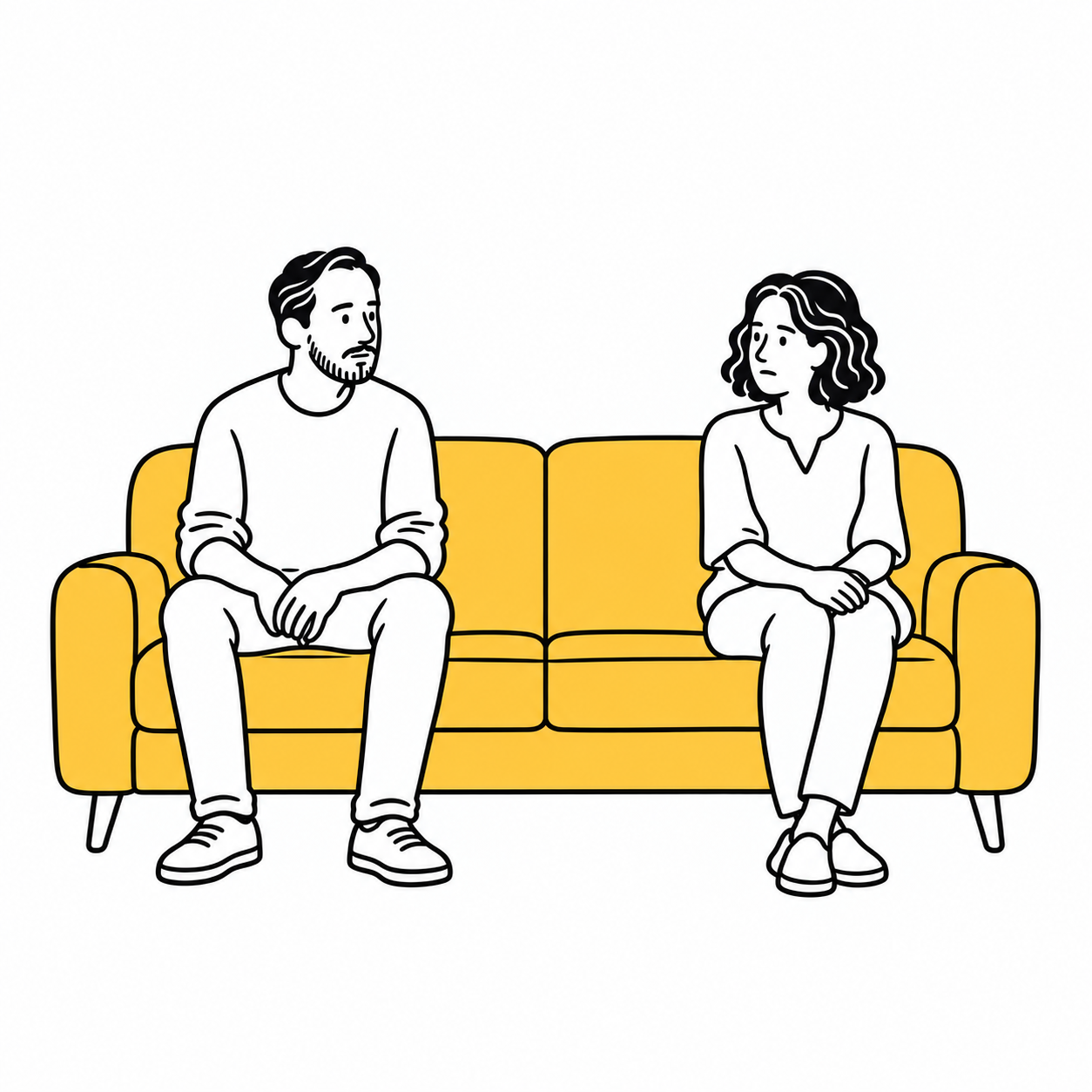 Una pareja sentada en un sofá, intentando conversar